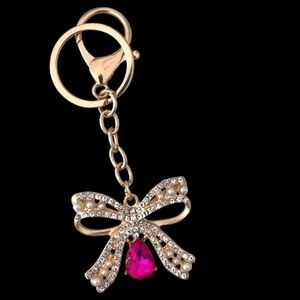 Elegant Crystal & Pearl Bow Bag Charm / Keychain with Fuchsia Crystal